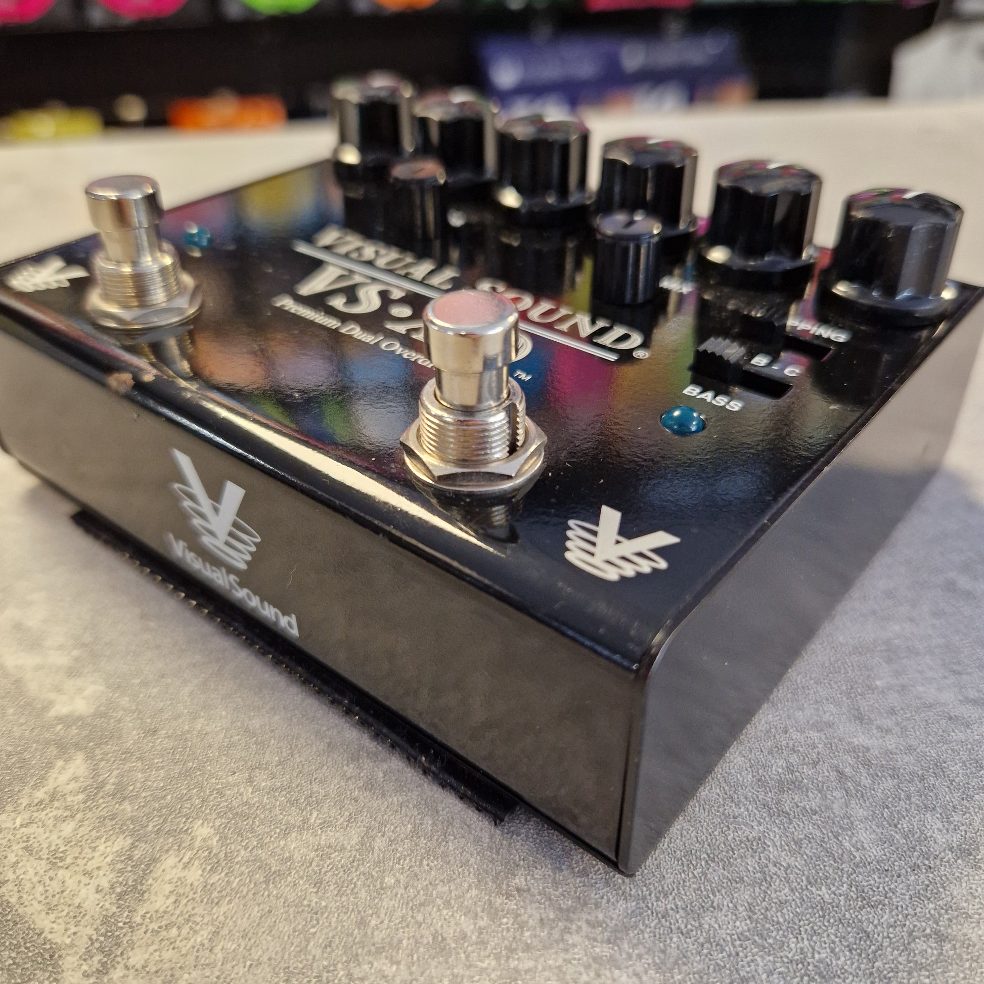 Pre-Owned Truetone VSXO Fender guitar effects pedal with knobs and switch on a textured surface