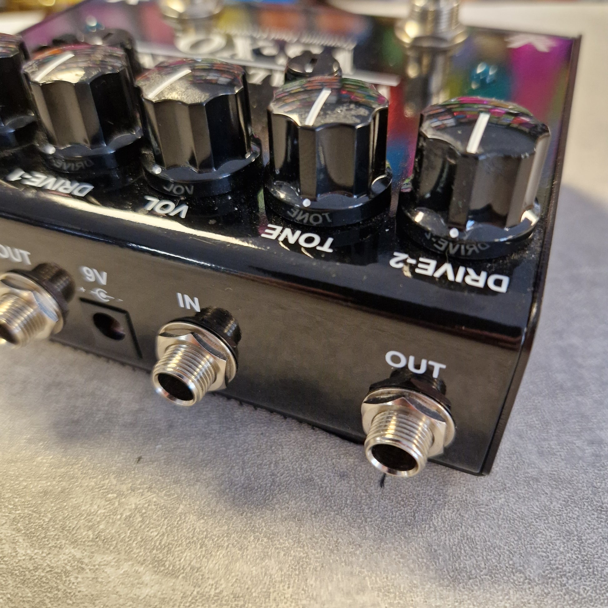 Pre-Owned Truetone VSXO Guitar effects pedal with control knobs and jacks on a textured surface