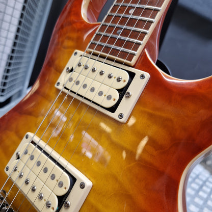 Pre-Owned Samick Close-up of a guitar with a sunburst finish and two pickups.