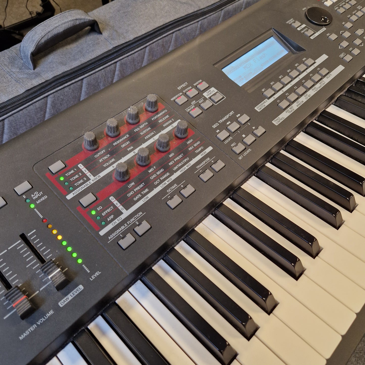 Pre-Owned Yamaha MOXF8 Keyboard with control panel and display on a gray surface