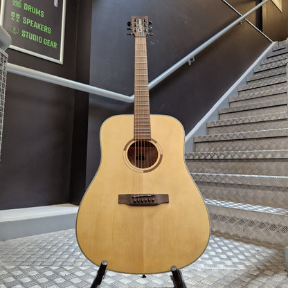 Pre-Owned Tanglewood TS5 Acoustic guitar leaning against a wall in a room with soundproofing panels.