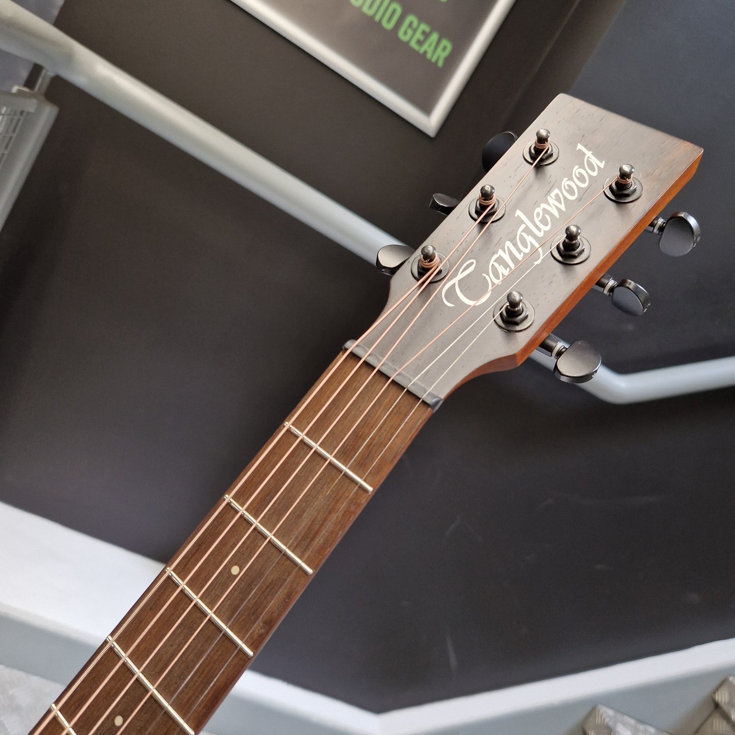 Pre-Owned Tanglewood TS5 Close-up of a guitar headstock with 'Camperes' branding on a dark background
