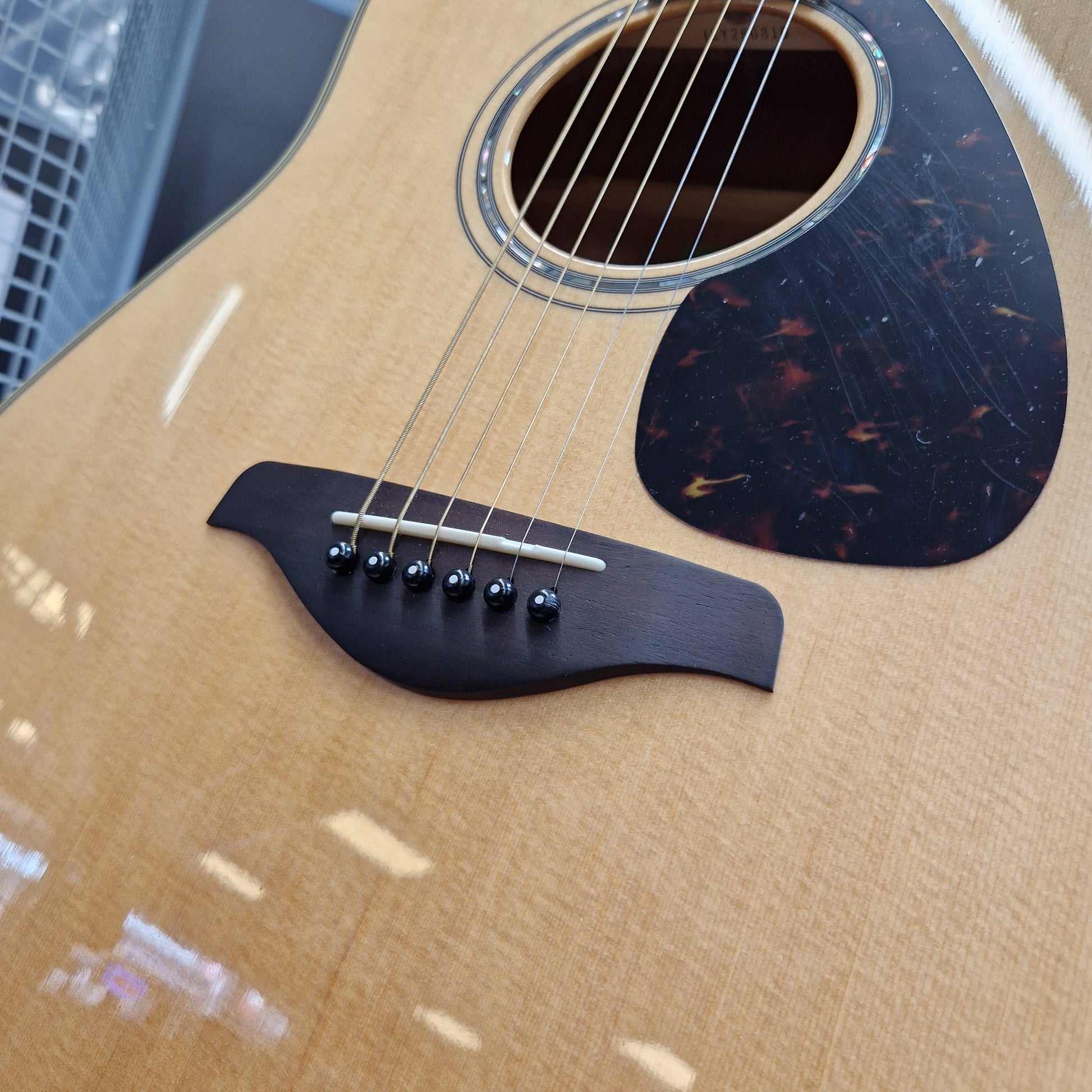 Pre-Owned Yamaha FG840 Close-up of a acoustic guitar with a focus on the soundhole and neck