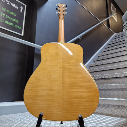 Pre-Owned Yamaha FG840 Wooden acoustic guitar leaning against a wall with soundproofing panels.