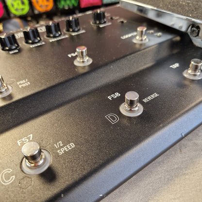 Pre-Owned Line 6 Close-up of a black metal electronic control panel with rotary switches, knobs, and white printed labels including 'FS8', 'D', '1/2 SPEED', and 'TAP'.