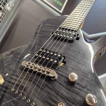 Pre-Owned Chapman ML-2 Electric - Grey Close-up of a black electric guitar body with a glossy flamed maple finish, chrome hardware, and black humbucker pickups.
