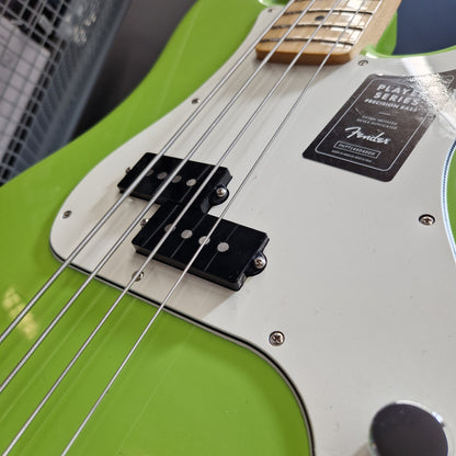 Pre-Owned Fender Player Precision Bass - Limited Edition Electron Green Close-up of a Fender bass guitar body in bright lime green with a white pickguard, black pickups, and silver strings.