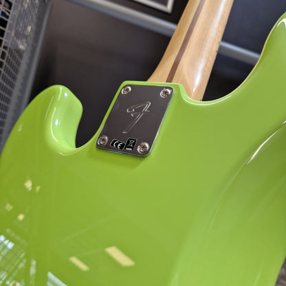 Pre-Owned Fender Player Precision Bass - Limited Edition Electron Green Close-up of the rear side of a bright lime green electric guitar body with a wood neck and a black hardware plate.