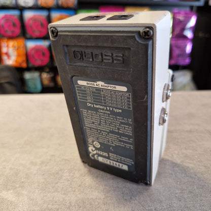Pre-Owned Boss TU-3 Tuner Pedal A Digigi Bass guitar pedal shown from the back, featuring a white top casing, two silver footswitches, and a black backplate with technical specifications printed on a label.