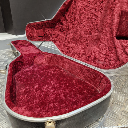 Pre-Owned Hiscox LiteFlite Acoustic Hard Case An open guitar case with a plush burgundy velvet interior lining and a black exterior shell with silver trim, resting on a metallic diamond-plate surface.