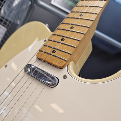 Pre-Owned Squier MIK 1996 Telecaster Electric - Blonde Close-up of a cream-colored electric guitar body with a natural wood fretboard and silver hardware.
