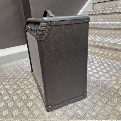 Pre-Owned Line 6 Spider V 120 Mk II Guitar Combo Amplifier A black guitar amplifier with a textured front grille and protective metal corners, positioned on a diamond plate metal staircase.