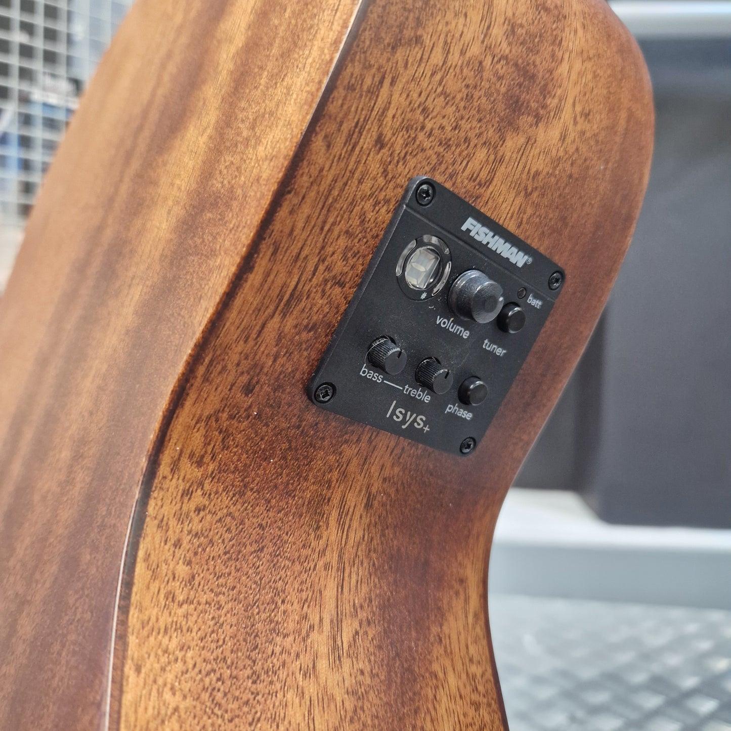 Pre-Owned Layke Smokestack Parlour Electro-Acoustic - Mahogany Close-up of the back of an acoustic guitar body with a black Fishman Isys tremolo control panel mounted on the wood surface.