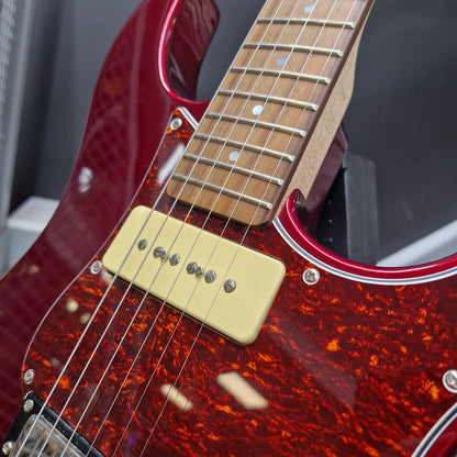 Pre-Owned Yamaha Pacifica 311H Electric - Red Metallic Close-up of an electric guitar body showing a glossy red maple finish with a dark tortoiseshell pattern, a cream single-coil pickup, and part of a light wood fretboard.
