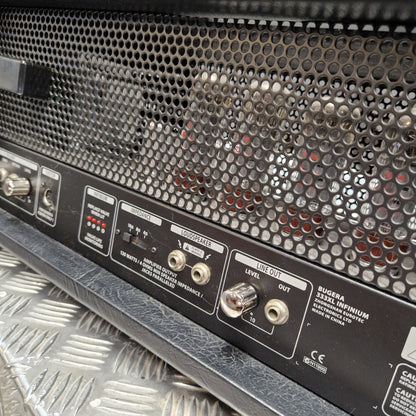 Pre-Owned Bugera 333XL Infinium 120w Electric Amplifer Head Close-up of the rear panel of a black Fugata Scream Impium speaker amplifier, showing input jacks, volume controls, and a perforated metal grille.