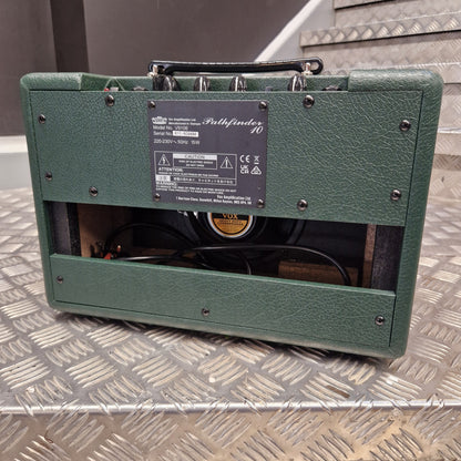 Pre-Owned Vox Pathfinder 10 Electric Amplifier Combo A green Marshall amplifier cabinet with its front panel open, showing the internal speaker and wiring, photographed against a diamond plate metal background.