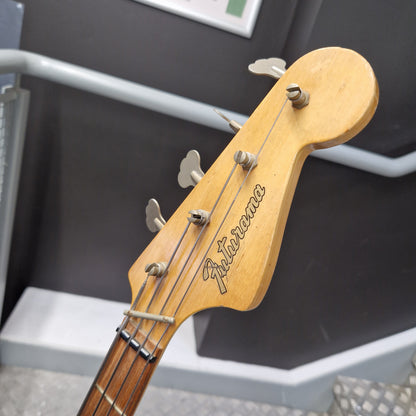 Pre-Owned Hagstrom Futurama Deluxe 1960s Bass - Red Close-up of a bass guitar headstock with four tuning pegs and strings, showing the brand name 'Fuzz Bass' in script on a light natural wood background.