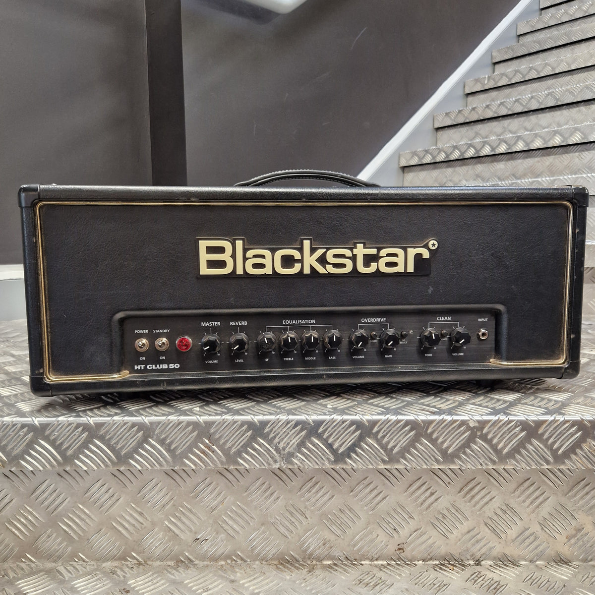 Pre-Owned Blackstar HT Club 50 Electric All-Valve Amplifier Head A Blackstar HA1000 guitar head amplifier photographed from above on a textured diamond-plate metal surface.