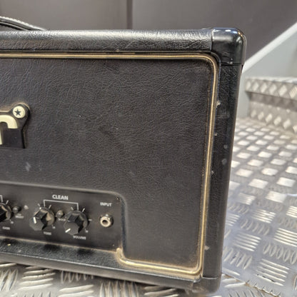 Pre-Owned Blackstar HT Club 50 Electric All-Valve Amplifier Head Close-up of the side and rear control panel of a black guitar amplifier with gold trim, showing knobs and a textured black leather-like front.