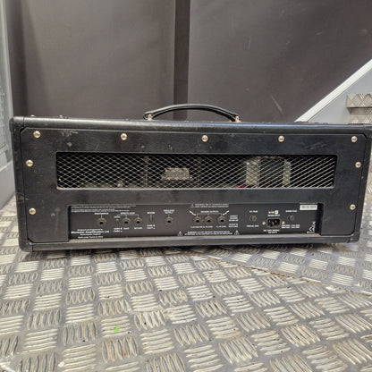 Pre-Owned Blackstar HT Club 50 Electric All-Valve Amplifier Head A black metal guitar amplifier cabinet shown from the back, featuring a mesh grille, screw holes, and multiple input/output jacks, photographed on a diamond plate metal floor.
