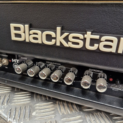 Pre-Owned Blackstar HT-5RH 5w Electric Amplifier Head w/ Footswitch - Close-up of a Blackstar amplifier head showing the front control panel with knobs and the Blackstar logo on the black textured cabinet.