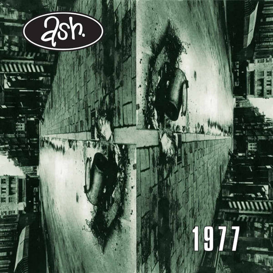 Ash - 1977 (30th Anniversary Edition Red) Vinyl Album cover with 'ash' logo and '1977' text, featuring a cityscape and large cylindrical object.