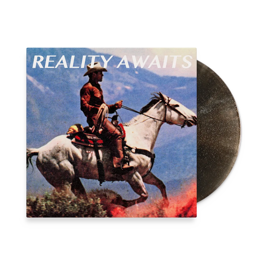 The Strokes - Reality Awaits (Black Ice Glitter) Vinyl Vinyl record album cover for 'Reality Awaits' featuring a cowboy riding a white horse with mountains and fire in the background, with a partially visible dark vinyl record behind the square cover.