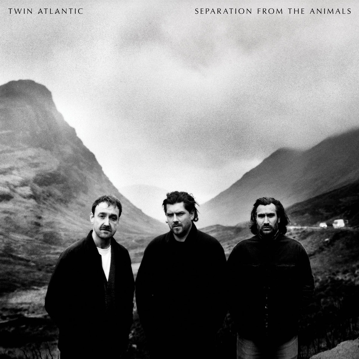 Twin Atlantic - Separation From The Animals (Clear Marble) Vinyl Album cover for Twin Atlantic's 'Separation From The Animals', featuring a black and white photograph of three men standing in a mountain valley.