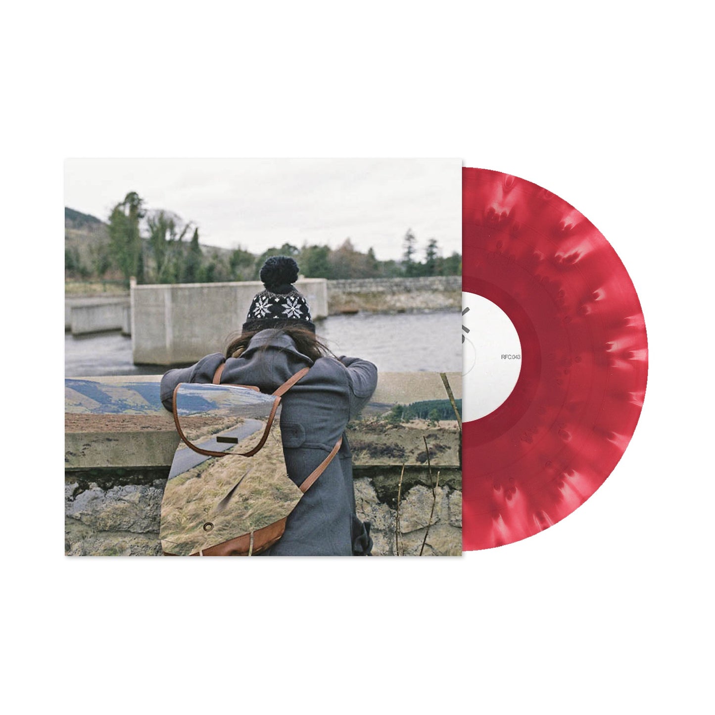 Basement - I Wish I Could Stay Here (Cloudy Maroon) Vinyl Person with a backpack looking at a scenic view, with a red vinyl record on the right.