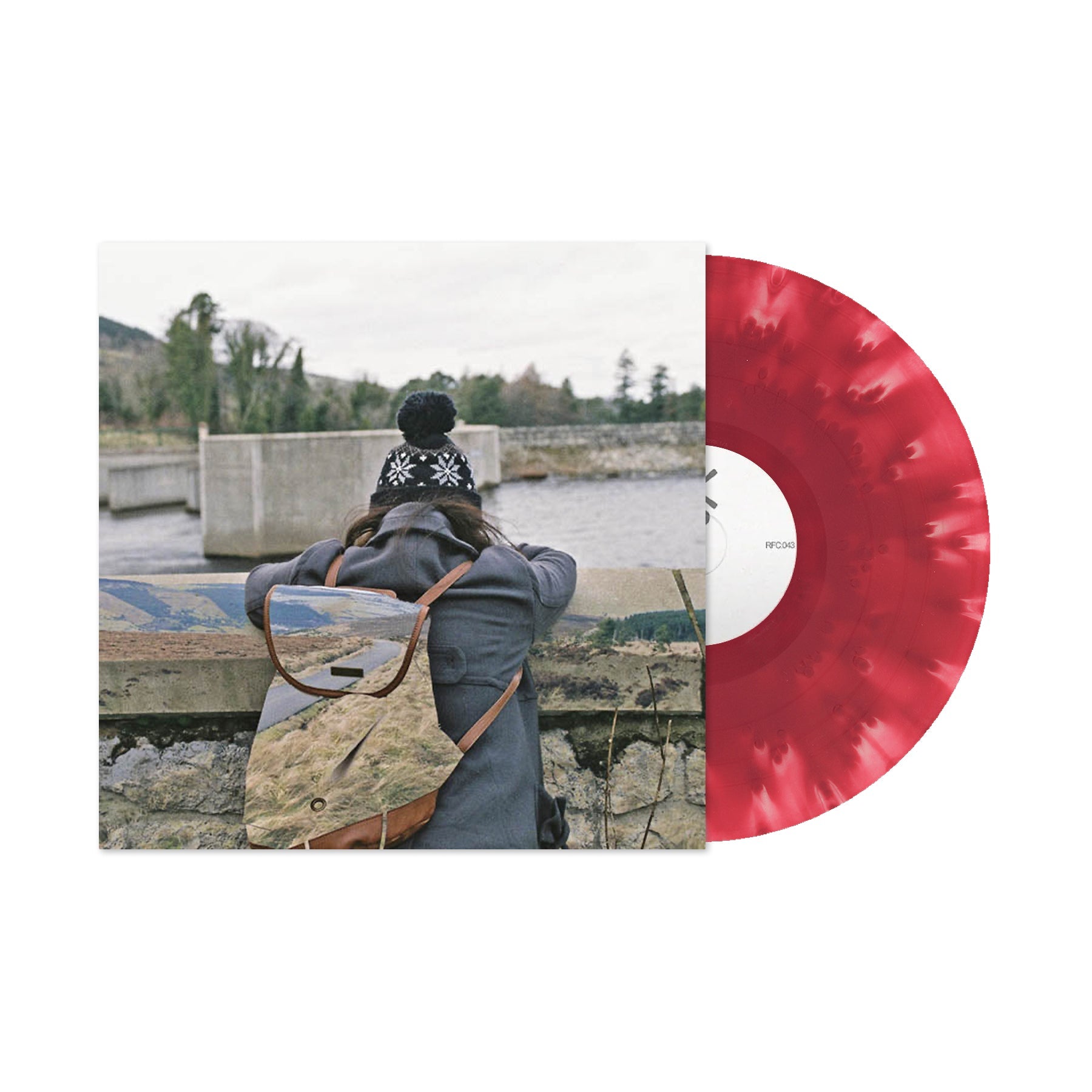 Basement - I Wish I Could Stay Here (Cloudy Maroon) Vinyl Person with a backpack looking at a scenic view, with a red vinyl record on the right.