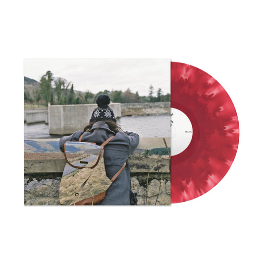 Basement - I Wish I Could Stay Here (Cloudy Maroon) Vinyl Person with a backpack looking at a scenic view, with a red vinyl record on the right.