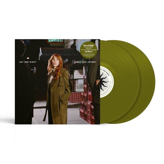 Carly Rae Jepson - Day and Night (Translucent Forest Green) Vinyl A vinyl record album shown with its cover art sleeve and two olive green records partially visible behind it on a clean white background.