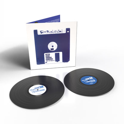 Fatboy Slim - Better Living Through Chemistry (30th Anniversary) Vinyl A vinyl record package shown on a white background, featuring two black LP records in front of a white sleeve or box printed with a blue floppy disk graphic and the text 'Better Living Through Computing'.