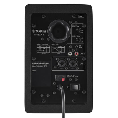 Back view of a Yamaha HS4 studio monitor with control knobs and connectors on a white background
