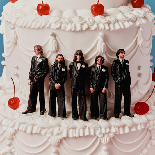 Blossoms - Songs From The Wedding Cake (Alt Artwork Splatter) Vinyl White wedding cake with five groom figurines and red cherries on a blue background