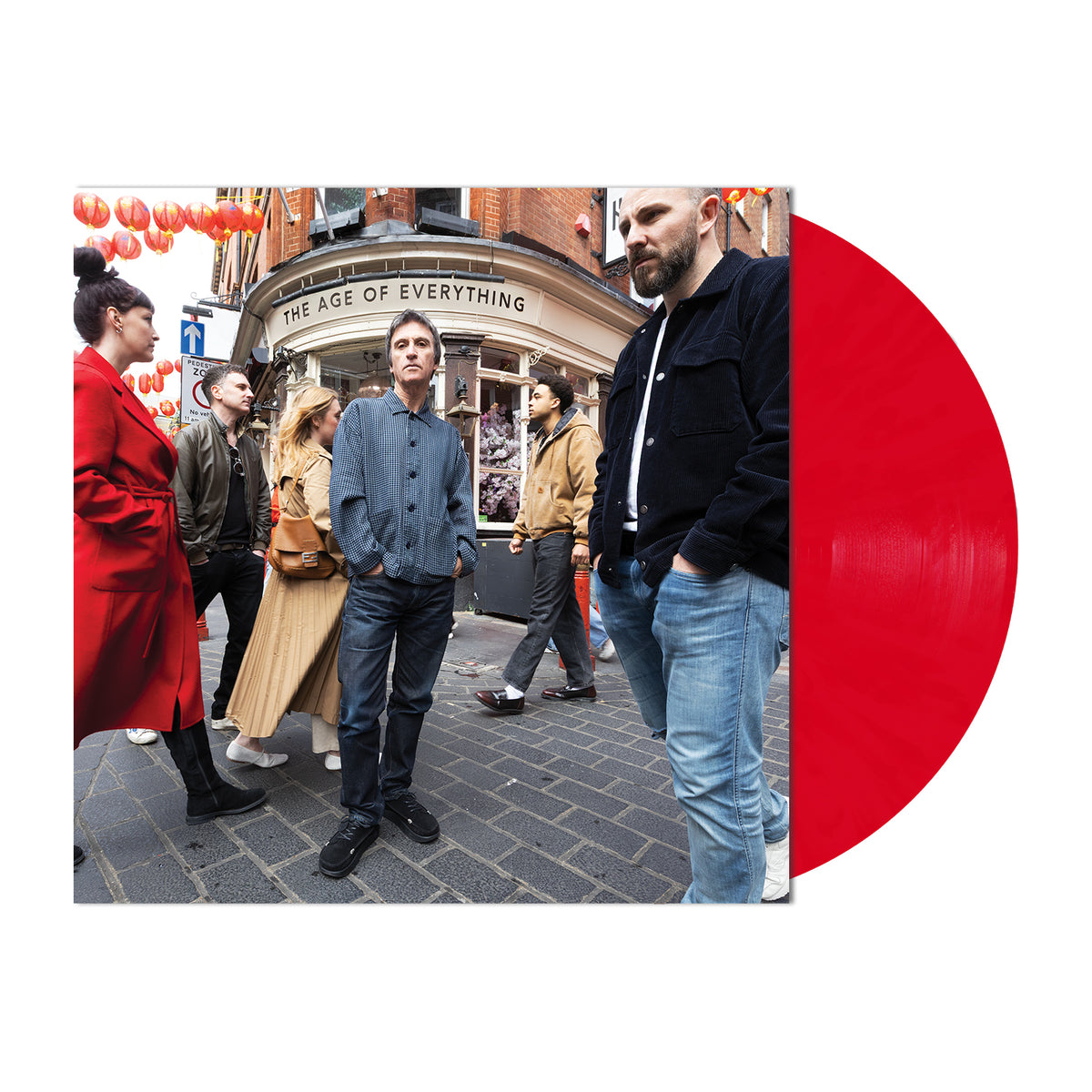 Johnny Marr - The Age of Everything (Red) Vinyl A vinyl record album cover featuring a street photograph of people in front of a pub, with a large bright red translucent record partially visible on the right against a white background.