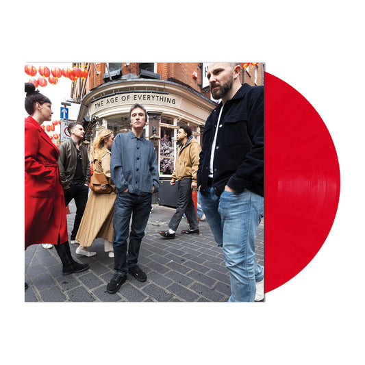 Johnny Marr - The Age of Everything (Red) Vinyl A vinyl record album cover featuring a street photograph of people in front of a pub, with a large bright red translucent record partially visible on the right against a white background.