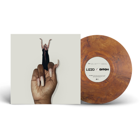Lizzo - Bitch Vinyl record with a hand holding it and a cover featuring a person in the air, on a white background.