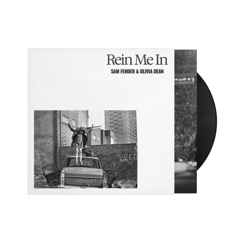 Sam Fender & Olivia Dean - Rein Me In Vinyl record with cover featuring a black and white photo of a person on a car, titled 'Rein Me In' by Sam Fender & Olivia Dean.