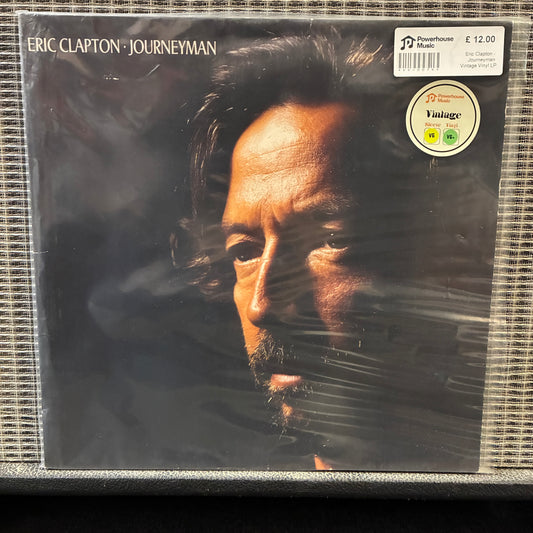 Eric Clapton - Journeyman Vinyl record cover of 'Journeyman' by Eric Clapton with a close-up of the artist's face.