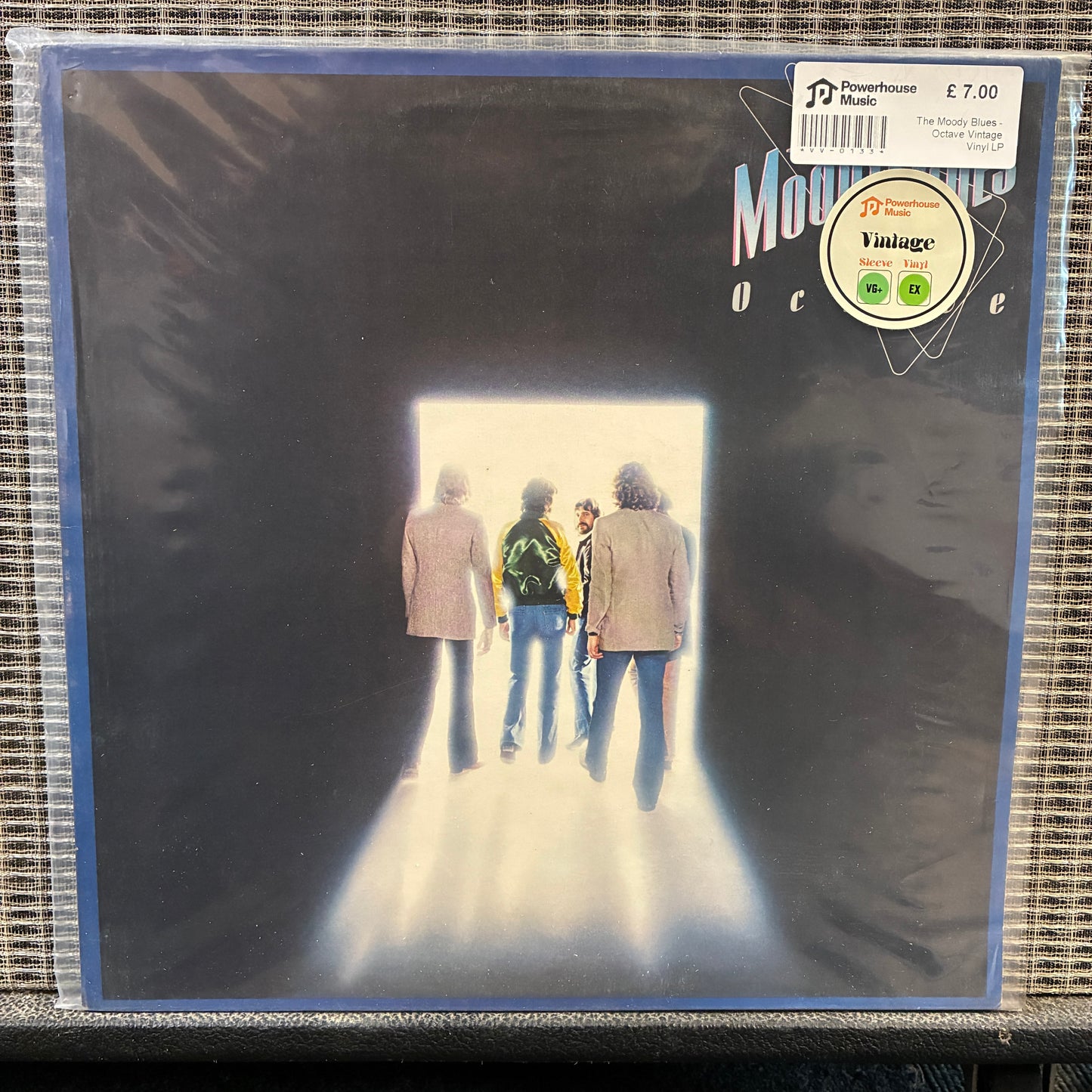 The Moody Blues - Octave Vinyl record cover with a group of people walking towards a light source