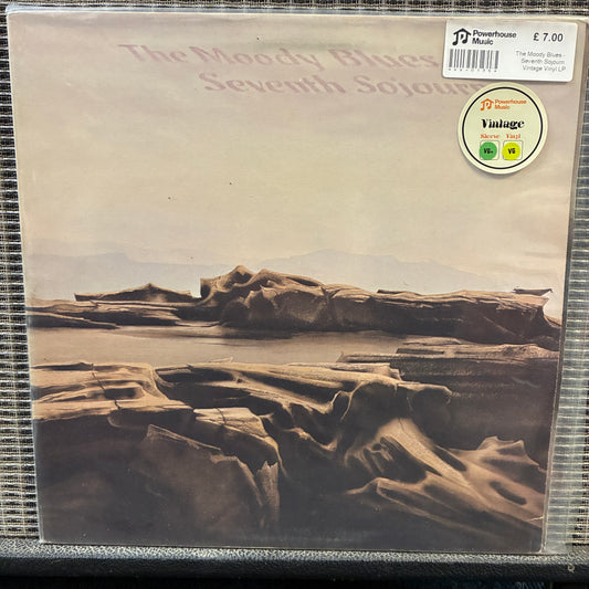 The Moody Blues - Seventh Sojourn Vinyl record cover with desert landscape and 'The Moody Blues Seventh Sojourn' text