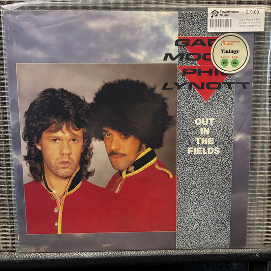 Gary Moore & Phil Lynott Vinyl record cover featuring two individuals in red jackets with a cloudy sky background.