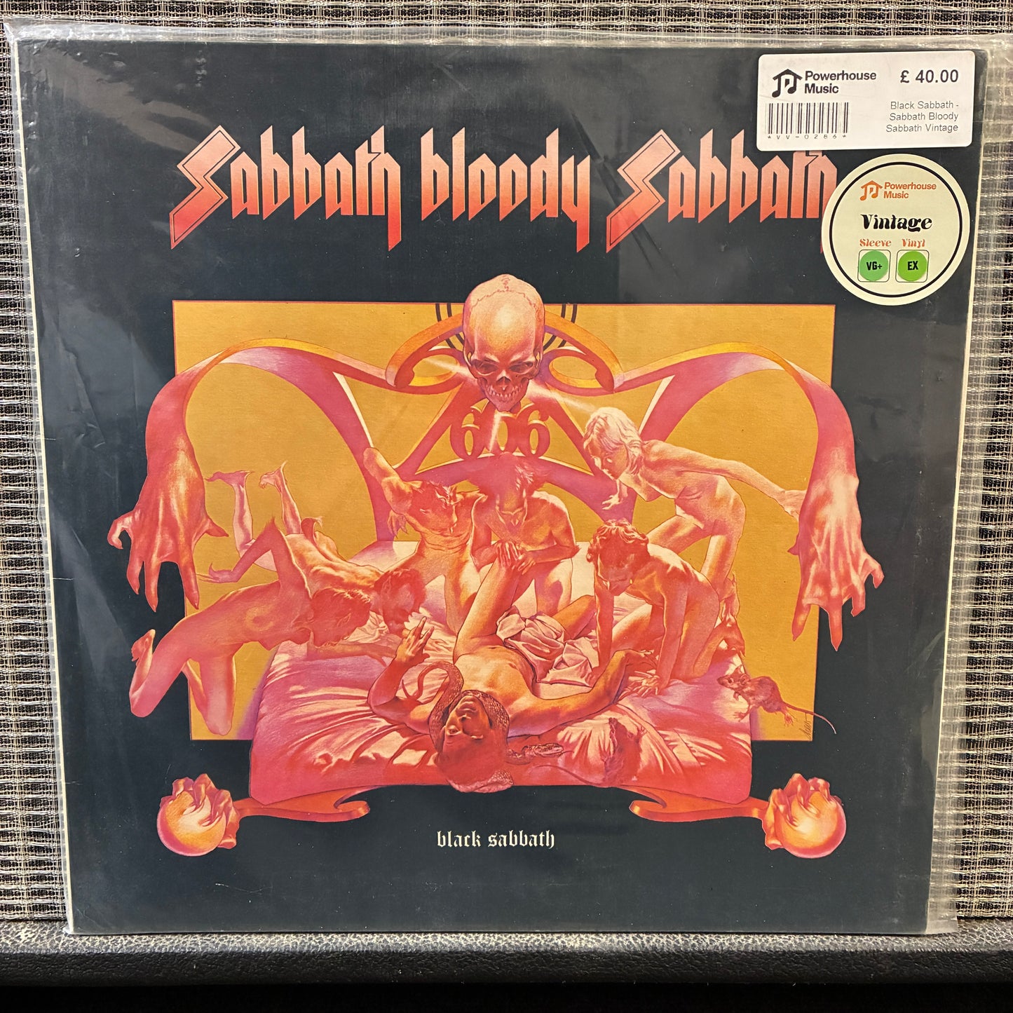 Black Sabbath - Sabbath Bloody Sabbath Vinyl record cover for 'Sabbath Bloody Sabbath' by Black Sabbath with a dark background and prominent text.