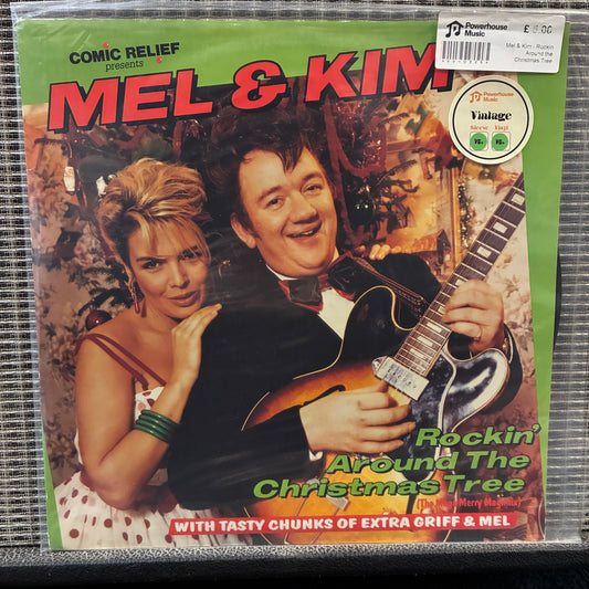 Mel & Kim - Rockin' Around the Christmas Tree Vinyl record cover featuring a man and woman with a guitar, labeled 'Mel & Kim'.