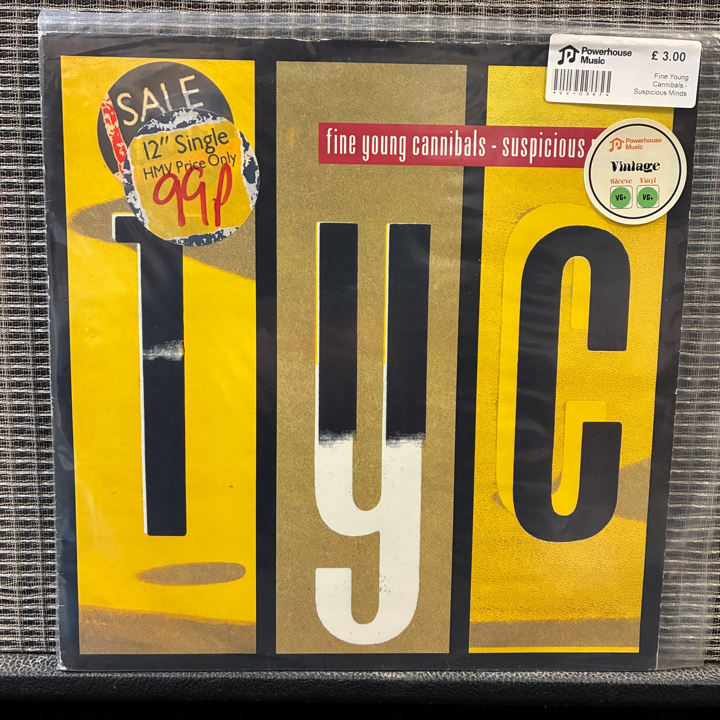 Fine Young Cannibals - Suspicious Minds Vinyl record cover for 'Suspicious' by Fine Young Cannibals with yellow, black, and red design.