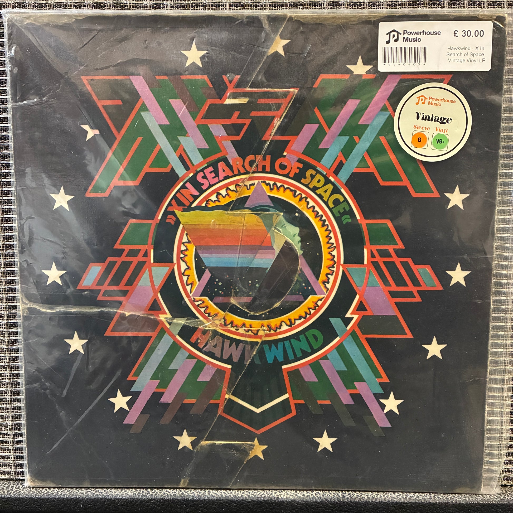Hawkwind - X In Search of Space Vinyl record cover with geometric design and text, featuring a starry night sky.
