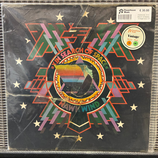 Hawkwind - X In Search of Space Vinyl record cover with geometric design and text, featuring a starry night sky.