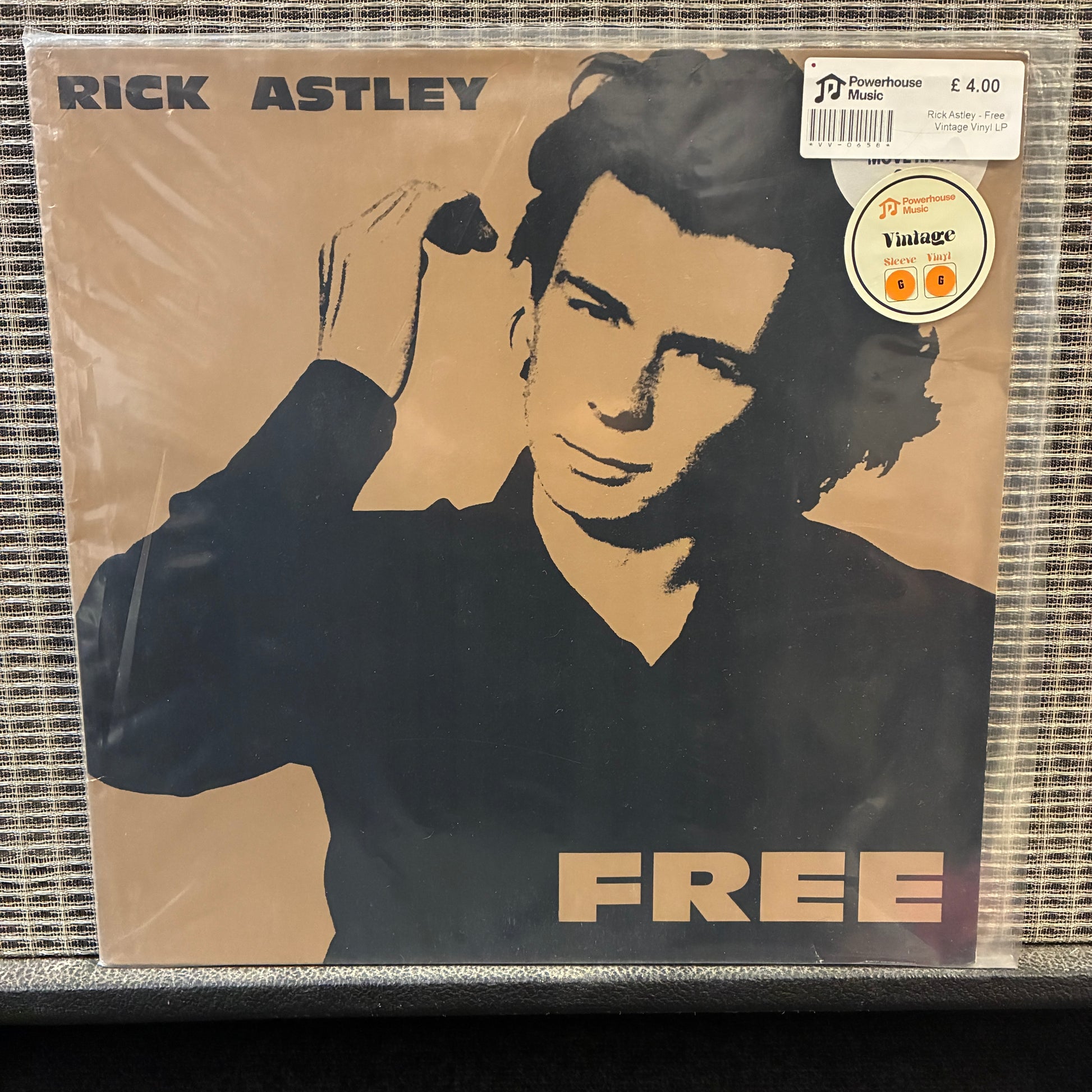 Rick Astley - Free Vinyl record cover with a portrait of a person and the word 'FREE' on a beige background