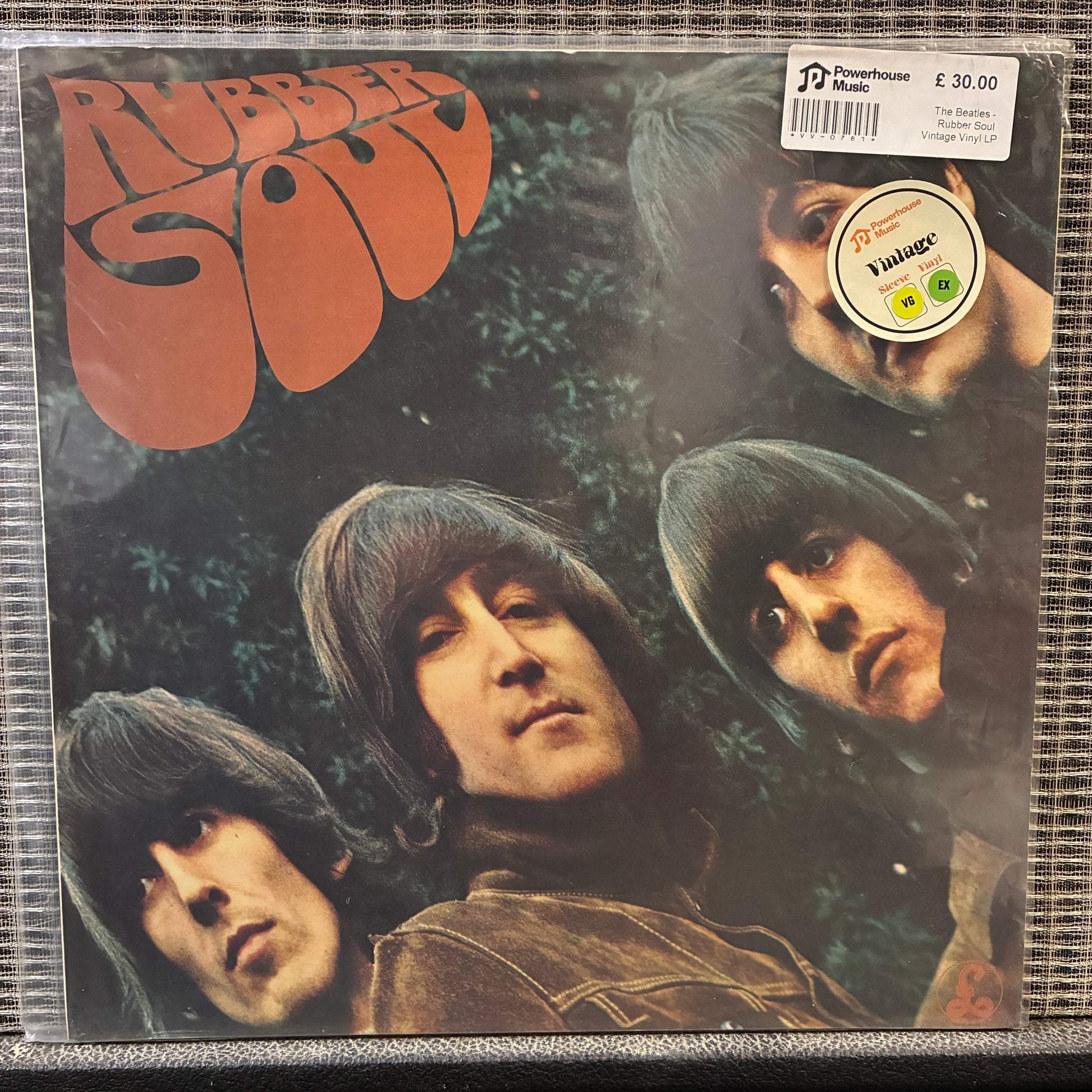 The Beatles - Rubber Soul Vinyl record cover for 'Rubber Soul' with band members' faces and album title.